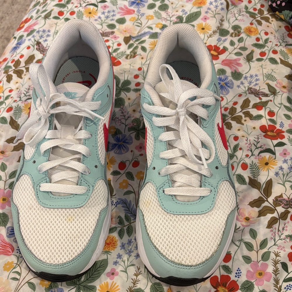 White and Light Blue Sneakers with Red Accents